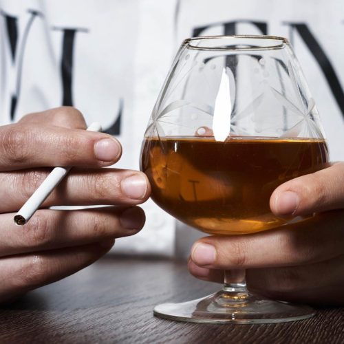 person-with-brandy-cigarette person-with-brandy-cigarette